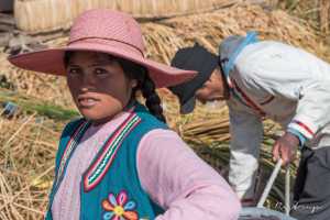 Indigenous young Peruvian woman living among the Uru people on floating islands in Lake Titicaca near Puno Peru