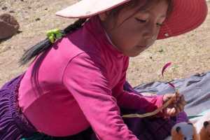 Indigenous Peruvian young girl on the Island of Taquile in Lake Titicaca Peru