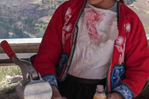 Indigenous Peruvian young woman at the Inca ruins in Pisac in the Sacred Valley of the Incas Peru, 1 of 2