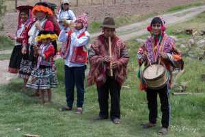 Indigenous Peruvian people in a small village in the Sacred Valley Peru. The community is processing wool to yarn and yarn to fabric, 1 of 7