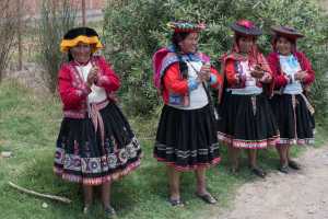 Indigenous Peruvian people in a small village in the Sacred Valley Peru. The community is processing wool to yarn and yarn to fabric, 2 of 7