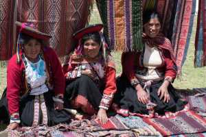 Indigenous Peruvian people in a small village in the Sacred Valley Peru. The community is processing wool to yarn and yarn to fabric, 7 of 7