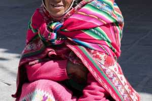 Indigenous Peruvian old woman captured in the Ollantaytambo market place