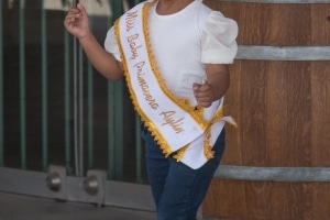 A proud little princess celebrated by her family at a private arrangement in a Pisco wineyard at ICA Peru